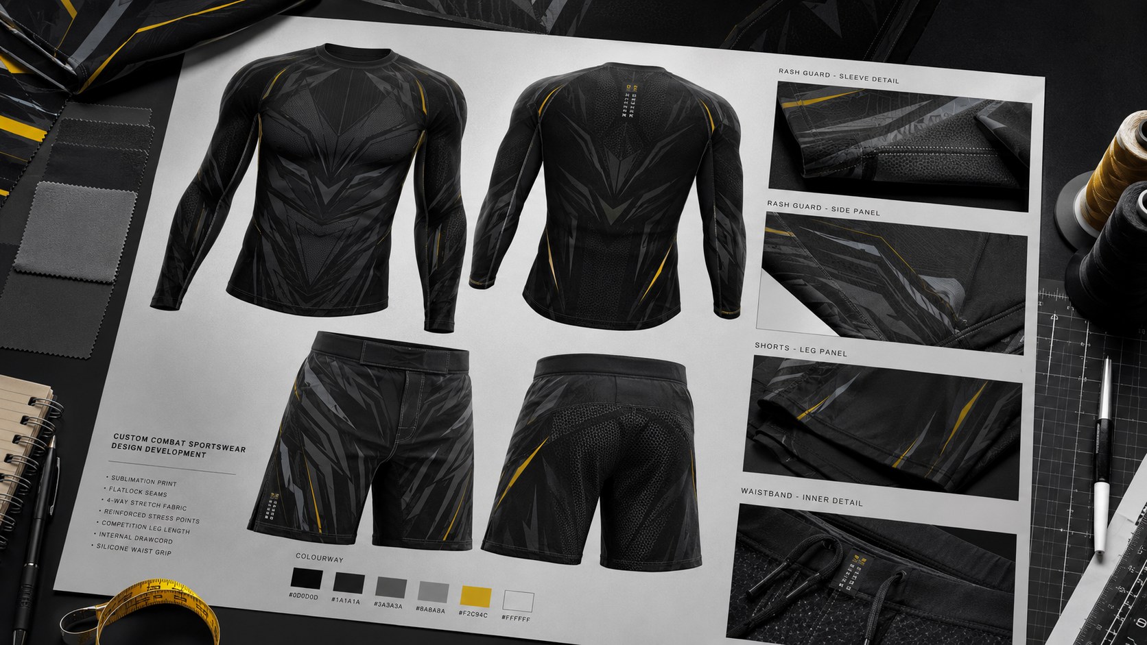 Complex combat sportswear artwork concepts arranged on a design table with a tape measure